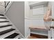 Cozy entryway featuring white wainscoting, built-in bench, and a tile floor at 3085 Balearic Se Dr, Marietta, GA 30067