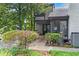 View of front exterior featuring beautiful green shrubs and lush landscaping at 3085 Balearic Se Dr, Marietta, GA 30067