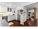 Kitchen featuring modern appliances, white cabinets, and an open layout leading to living areas at 3085 Balearic Se Dr, Marietta, GA 30067
