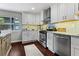 Updated kitchen with modern appliances, granite countertops, and white cabinetry at 3085 Balearic Se Dr, Marietta, GA 30067