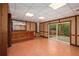 Partially finished basement including wet bar and walkout access to patio, offers an indoor-outdoor living experience at 1800 East Gate Dr, Smoke Rise, GA 30087