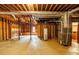 Unfinished basement with visible ductwork and utilities, presenting a blank canvas for custom renovation and design at 1800 East Gate Dr, Smoke Rise, GA 30087