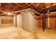 Unfinished basement with concrete foundation, perfect for storage, and potential for customizable living space at 1800 East Gate Dr, Smoke Rise, GA 30087