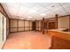 Unfinished basement with tile flooring, exposed support beams, offering ample space for customization and storage at 1800 East Gate Dr, Smoke Rise, GA 30087