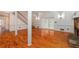 Finished basement featuring hardwood floors, a stone fireplace, and access to the outdoors at 1800 East Gate Dr, Smoke Rise, GA 30087