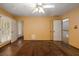A well-lit bedroom boasts hardwood floors, natural light, and ample space for comfortable living at 1800 East Gate Dr, Smoke Rise, GA 30087