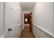 A cozy hallway leads to a room, offering a glimpse of the home's layout and potential at 1800 East Gate Dr, Smoke Rise, GA 30087