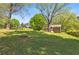 Expansive backyard featuring mature trees and lush greenery surrounds a charming home, perfect for outdoor enjoyment at 4819 Elam Rd, Stone Mountain, GA 30083