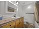 Bright bathroom with wooden cabinets and a tiled floor at 4819 Elam Rd, Stone Mountain, GA 30083