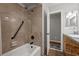 Bathroom featuring tiled shower, tub, and stylish wooden vanity at 4819 Elam Rd, Stone Mountain, GA 30083