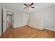 This bedroom features hardwood floors, ceiling fan, and closet at 4819 Elam Rd, Stone Mountain, GA 30083