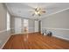 Spacious bedroom with hardwood floors, neutral walls, and multiple entryways at 4819 Elam Rd, Stone Mountain, GA 30083