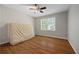 Bedroom featuring a ceiling fan and window with natural light at 4819 Elam Rd, Stone Mountain, GA 30083