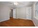 Bedroom with hardwood floors, light gray walls, and a window at 4819 Elam Rd, Stone Mountain, GA 30083