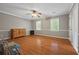 Large bedroom with wood floors and dual windows, offering ample natural light and a serene atmosphere at 4819 Elam Rd, Stone Mountain, GA 30083