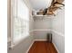 Walk-in closet with built-in shelving and wooden floors at 4819 Elam Rd, Stone Mountain, GA 30083