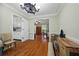 Open-concept dining room with hardwood floors and decorative lighting at 4819 Elam Rd, Stone Mountain, GA 30083