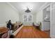 Spacious dining room with hardwood floors, crown molding, and an elegant chandelier at 4819 Elam Rd, Stone Mountain, GA 30083