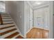 Bright entryway featuring hardwood floors, a staircase, and an ornate front door with sidelights at 4819 Elam Rd, Stone Mountain, GA 30083