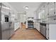 Well-equipped kitchen with granite counters, stainless steel appliances, and ample cabinet space at 4819 Elam Rd, Stone Mountain, GA 30083