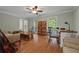 Comfortable living room with hardwood floors, ceiling fan, and large windows for natural light at 4819 Elam Rd, Stone Mountain, GA 30083