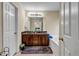 Bathroom featuring a double vanity, soaking tub, and neutral colored walls at 510 Ashland Manor Dr, Lawrenceville, GA 30045