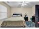 Bedroom featuring a bed, ceiling fan, window and patterned rug at 510 Ashland Manor Dr, Lawrenceville, GA 30045