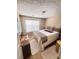 Bedroom featuring a double bed, a window and neutral colored decor at 510 Ashland Manor Dr, Lawrenceville, GA 30045