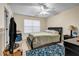 Bedroom featuring a bed, ceiling fan, window and patterned rug at 510 Ashland Manor Dr, Lawrenceville, GA 30045
