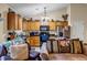 Kitchen featuring wooden cabinets, black appliances, and granite countertops at 510 Ashland Manor Dr, Lawrenceville, GA 30045