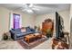 Cozy living room with a plush sofa, patterned rug, and entertainment center at 510 Ashland Manor Dr, Lawrenceville, GA 30045