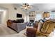 Open living room featuring high ceilings, comfortable seating, a fireplace, and a TV at 510 Ashland Manor Dr, Lawrenceville, GA 30045