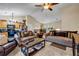 Spacious living room with seating, a kitchen view, and an adjacent dining area under vaulted ceiling at 510 Ashland Manor Dr, Lawrenceville, GA 30045