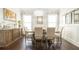 Elegant dining room with a chandelier, large table, and stylish furnishings for formal gatherings at 715 Laura Jean Court, Buford, GA 30518