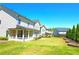 Expansive backyard with covered patio, perfect for outdoor entertaining at 715 Laura Jean Ct, Buford, GA 30518