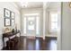 Welcoming foyer with hardwood floors, elegant decor, and natural light at 715 Laura Jean Ct, Buford, GA 30518