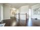 Hallway with hardwood floors, white trim, and access to other rooms at 715 Laura Jean Ct, Buford, GA 30518