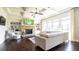 Bright and spacious living room with fireplace, built-in shelving, and large windows at 715 Laura Jean Ct, Buford, GA 30518