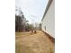 New home with a wide backyard featuring fresh sod, offering a serene outdoor space at 120 Cedar Cliff Ct, Temple, GA 30179