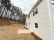 New home showcasing a spacious backyard with newly installed sod and landscaping potential at 120 Cedar Cliff Ct, Temple, GA 30179