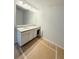Bathroom featuring a double sink vanity with granite countertop and a large mirror at 120 Cedar Cliff Ct, Temple, GA 30179