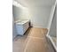 This is a bright bathroom featuring a double sink vanity with granite countertop at 120 Cedar Cliff Ct, Temple, GA 30179