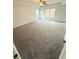 Spacious bedroom features plush carpeting, a ceiling fan, and ample natural light at 120 Cedar Cliff Ct, Temple, GA 30179