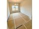 View of the dining room featuring modern lighting and large window at 120 Cedar Cliff Ct, Temple, GA 30179