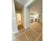 View of the kitchen featuring white cabinets, an island, and a view into a powder room at 120 Cedar Cliff Ct, Temple, GA 30179
