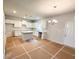 Open concept kitchen showcasing island with granite counters, white cabinetry, and stainless appliances at 120 Cedar Cliff Ct, Temple, GA 30179