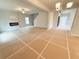 Open-concept living room with fireplace and entry way, featuring a ceiling fan at 120 Cedar Cliff Ct, Temple, GA 30179