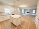 Bright open-concept living room featuring a kitchen with island and an inviting atmosphere at 120 Cedar Cliff Ct, Temple, GA 30179