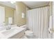 Clean and bright bathroom with white fixtures and shower/tub combination at 325 N Saint Phillip Ln, Alpharetta, GA 30022