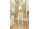 Grand foyer with high ceilings, hardwood floors, and a staircase, creating a spacious entry at 325 N Saint Phillip Ln, Alpharetta, GA 30022